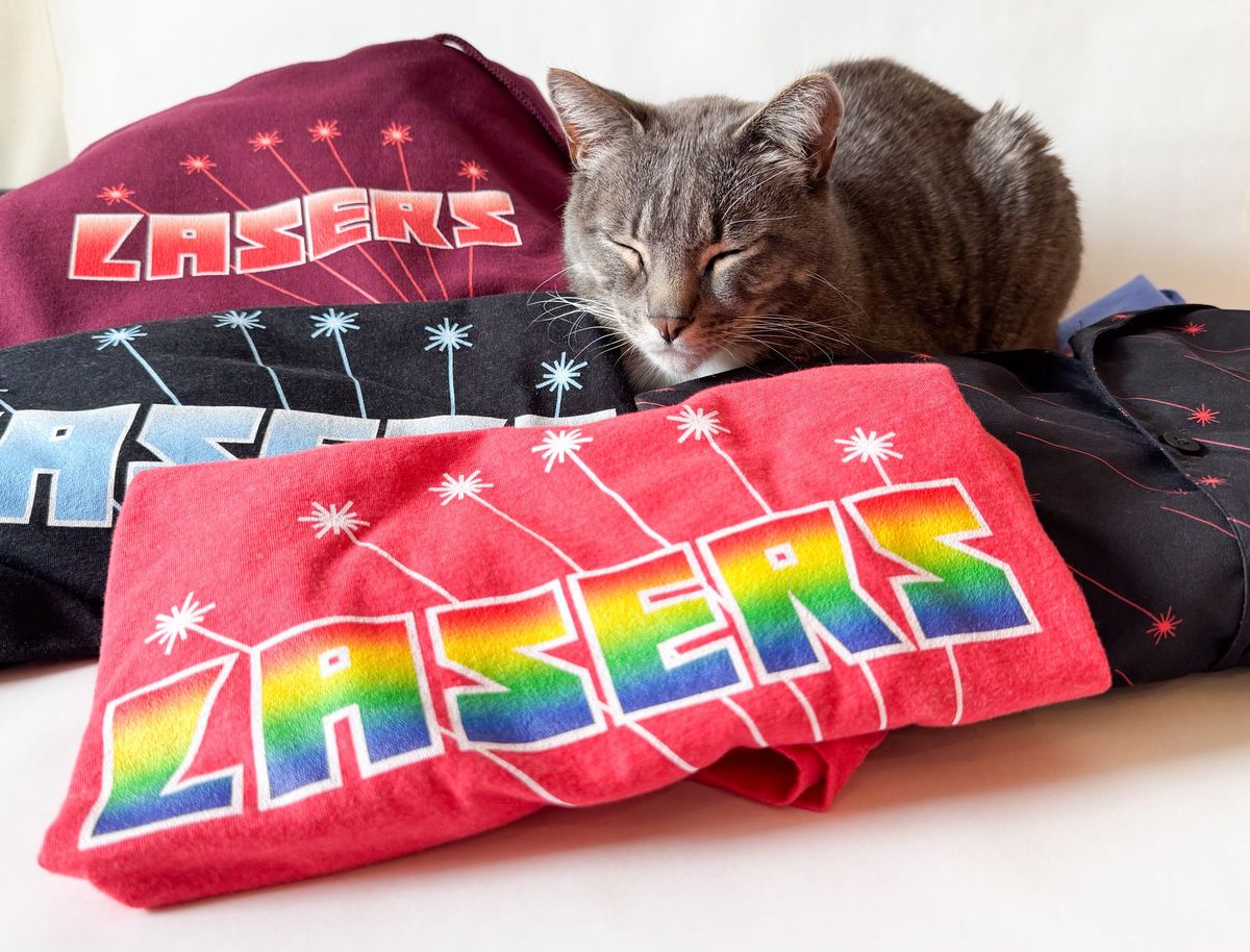 Laser merch photoshoot (sabotaged by cat)