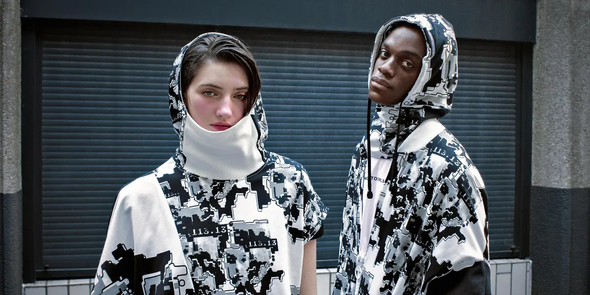 Adversarial Fashion Confronts Surveillance Norms
