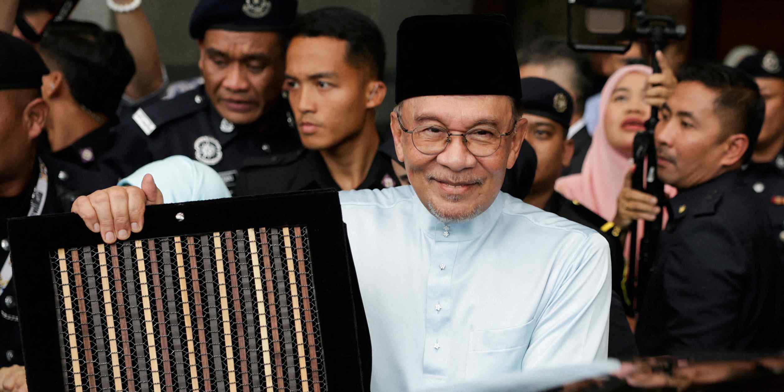 Malaysia cuts income tax and raises wage floors as election approaches